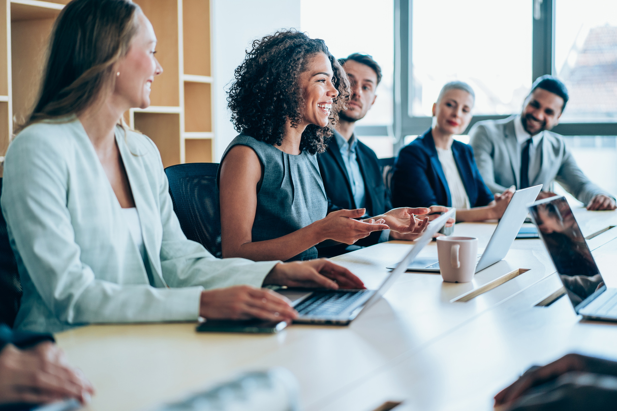 Group of business persons in business meeting.