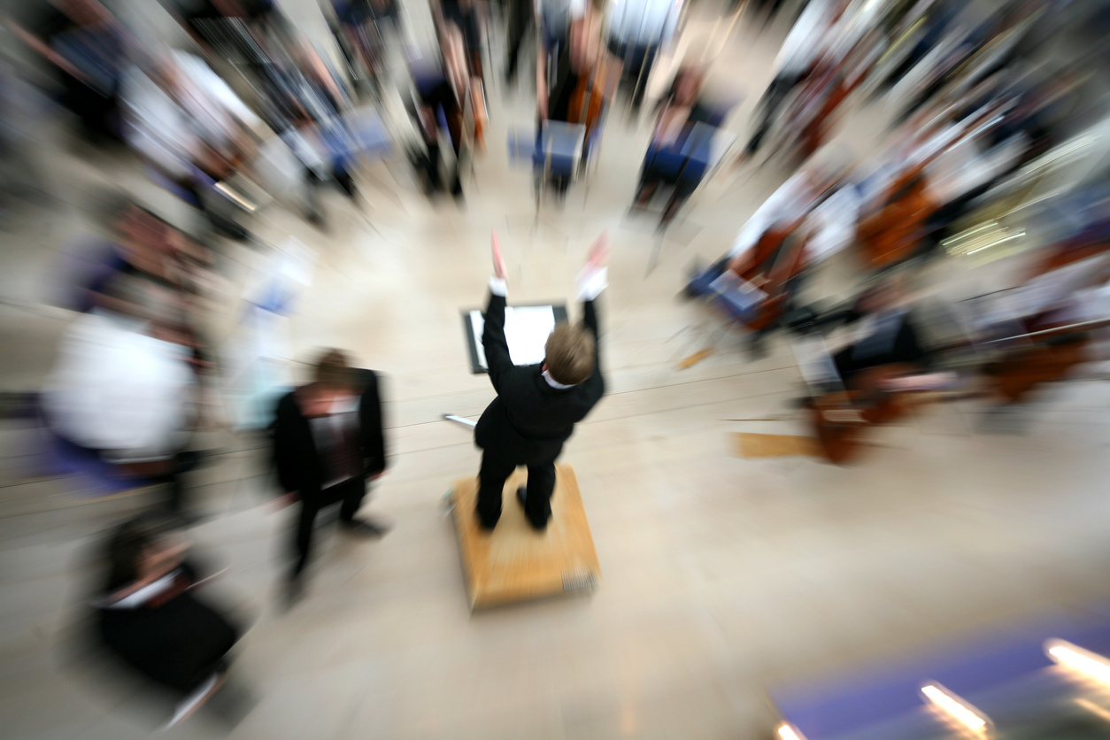 Maestro conducting blurry crowd