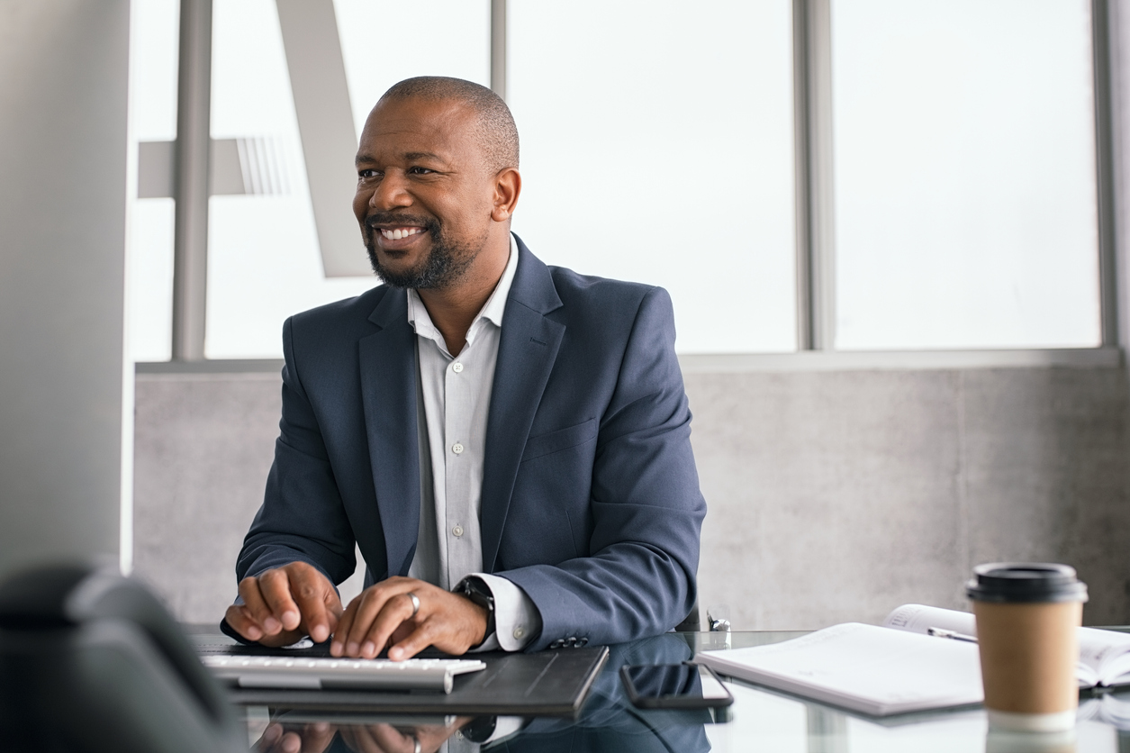 African American businessman working on his laptop at office.