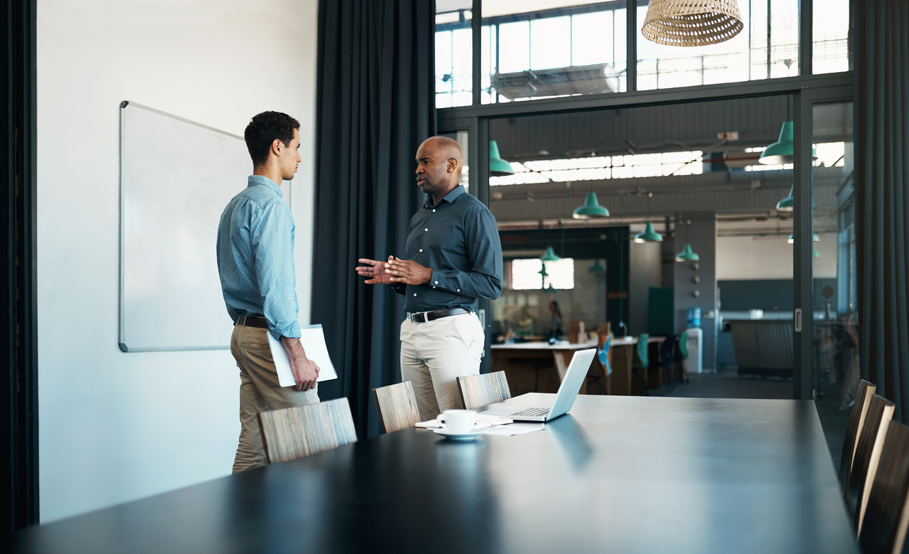 Businessman leadership speaking to employee.