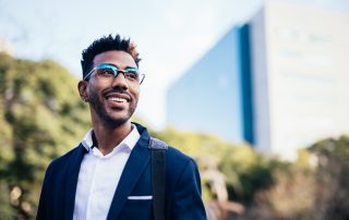 Portrait of dreamy young black man happy about reaching his goals.