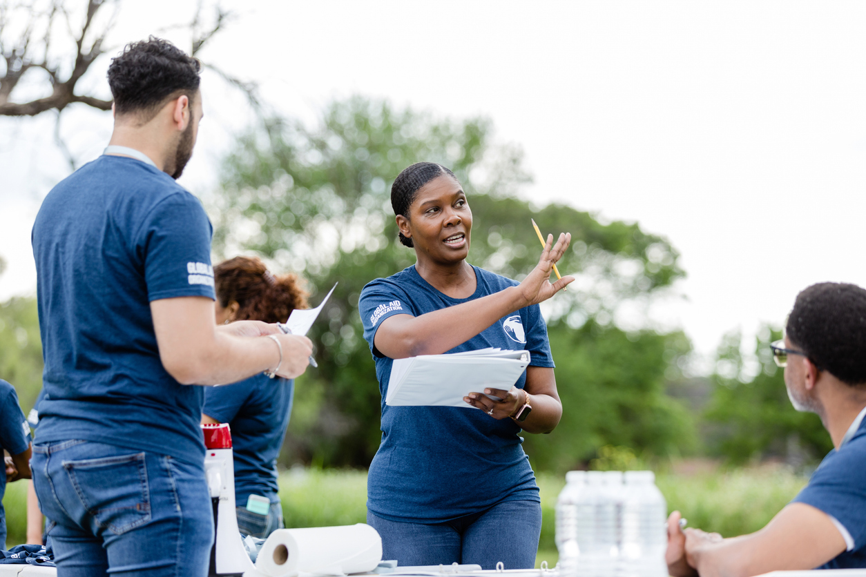 Non-Profit Leader giving instructions to volunteers