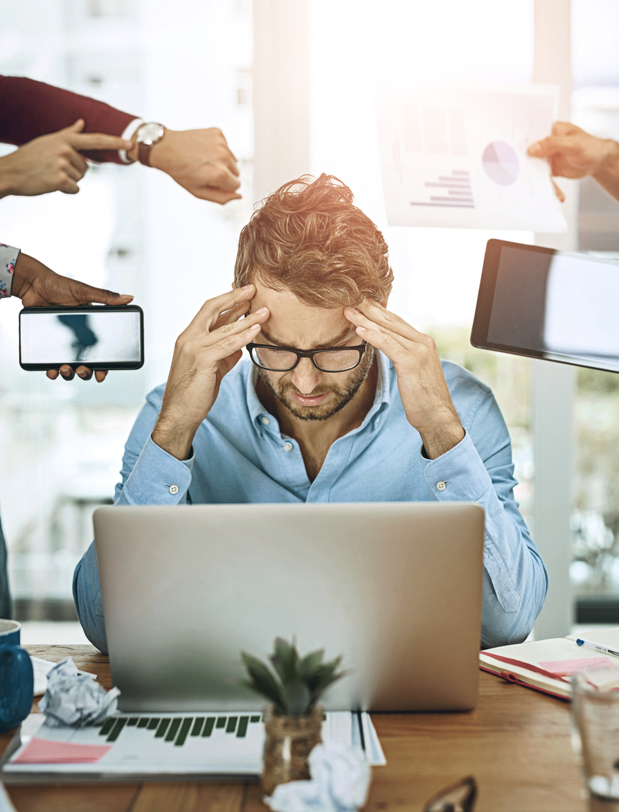 Multitask, headache and man at desk with deadlines, stress and burnout at laptop in office. Male accountant, overwhelmed and technology in workplace with anxiety, tension and pain at computer Overwhelmed Manager